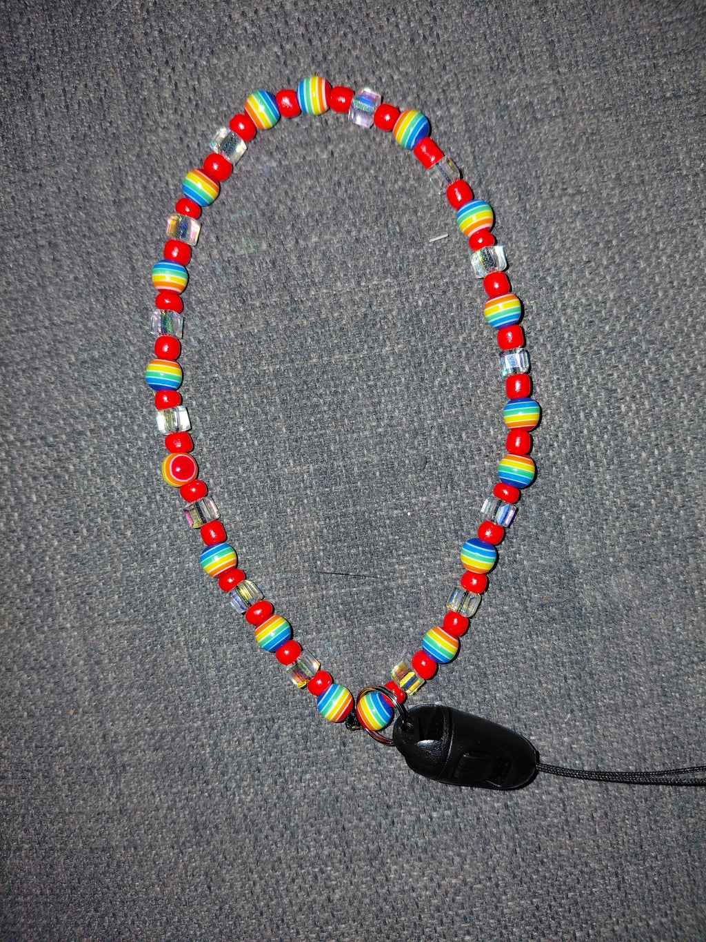 Rainbow beaded phone wristlet with red seed beads and crystal cube beads