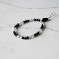 Black Ice Beaded Phone Wristlet white marble flat lay