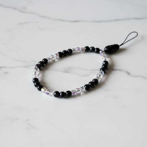 Black Ice Beaded Phone Wristlet white marble flat lay